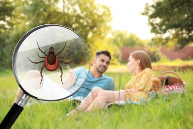Happy couple having picnic in park and don't even suspect about hidden danger in green grass. Illustration of magnifying glass with tick, selective focus