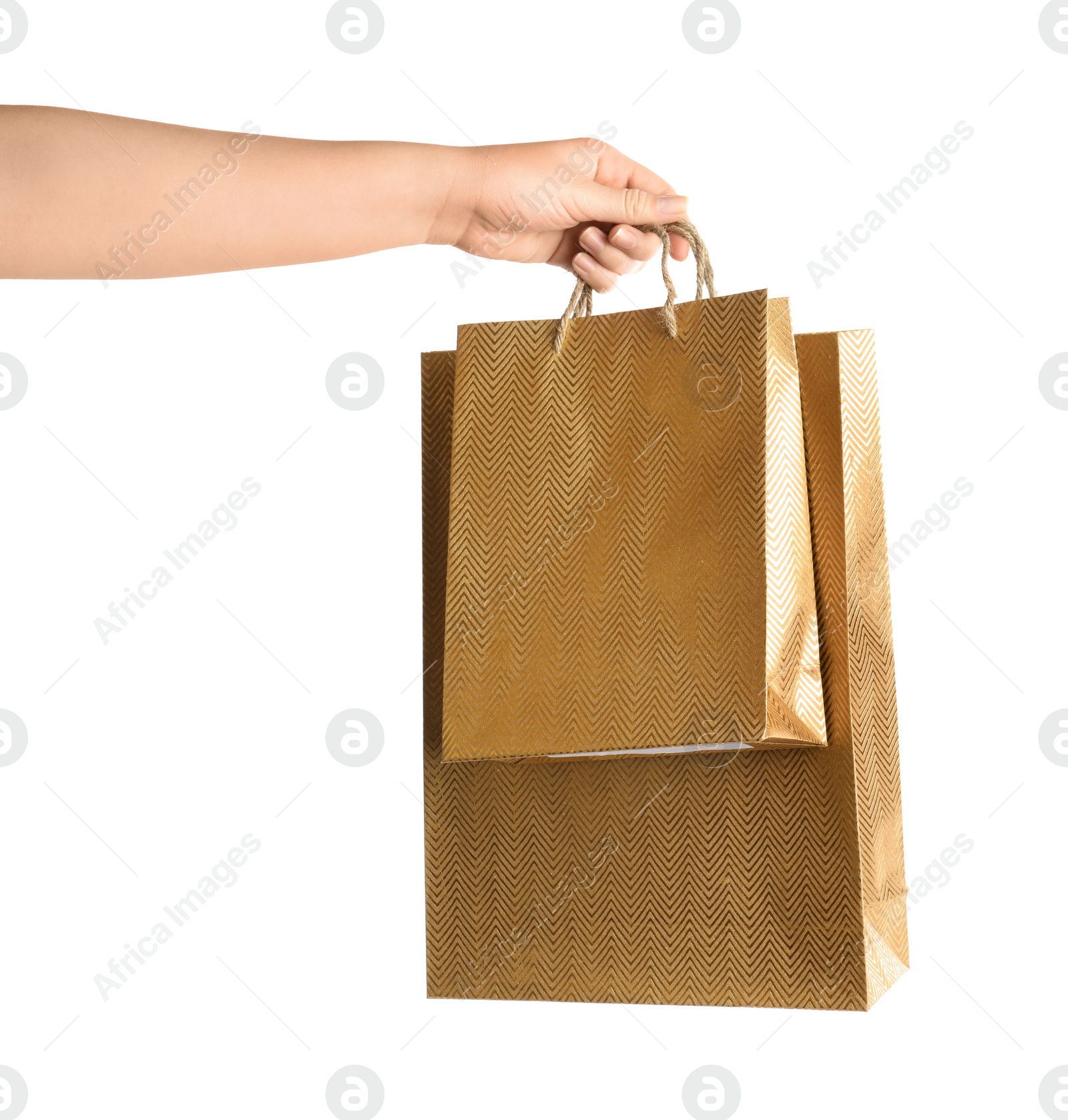 Photo of Woman holding paper shopping bags on white background, closeup. Space for design