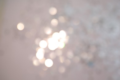 Photo of Shiny lilac background with magical bokeh effect