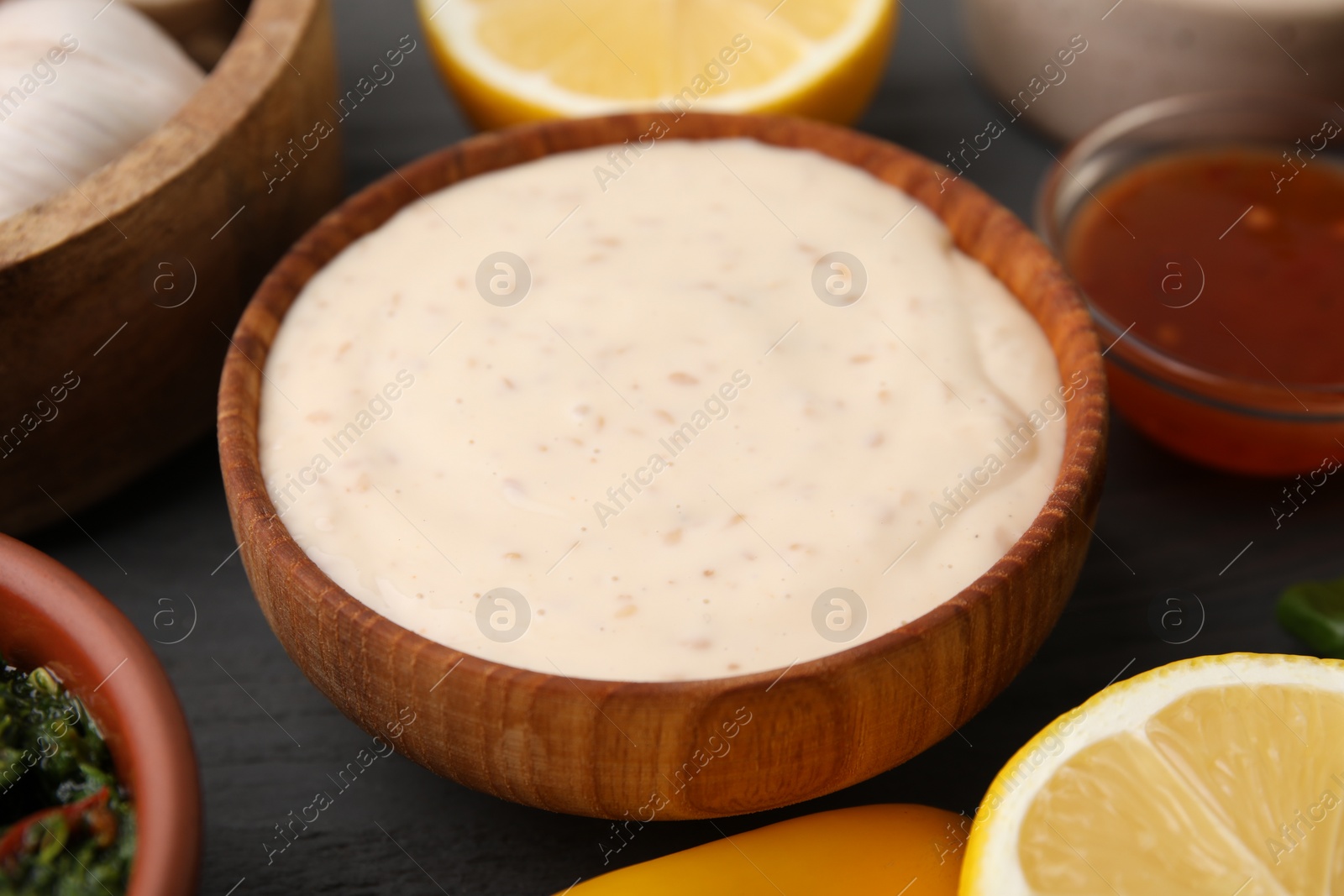 Photo of Fresh marinade in bowl on grey table, closeup