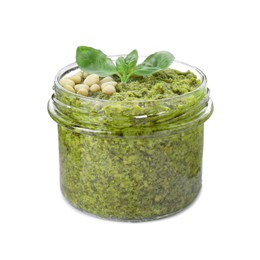 Photo of Jar with delicious pesto sauce, pine nuts and basil leaves isolated on white