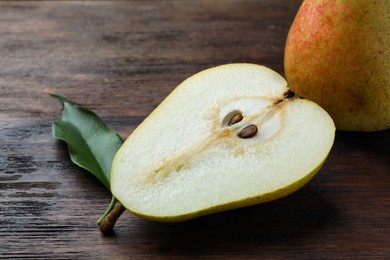 Tasty fresh pears on wooden table, closeup