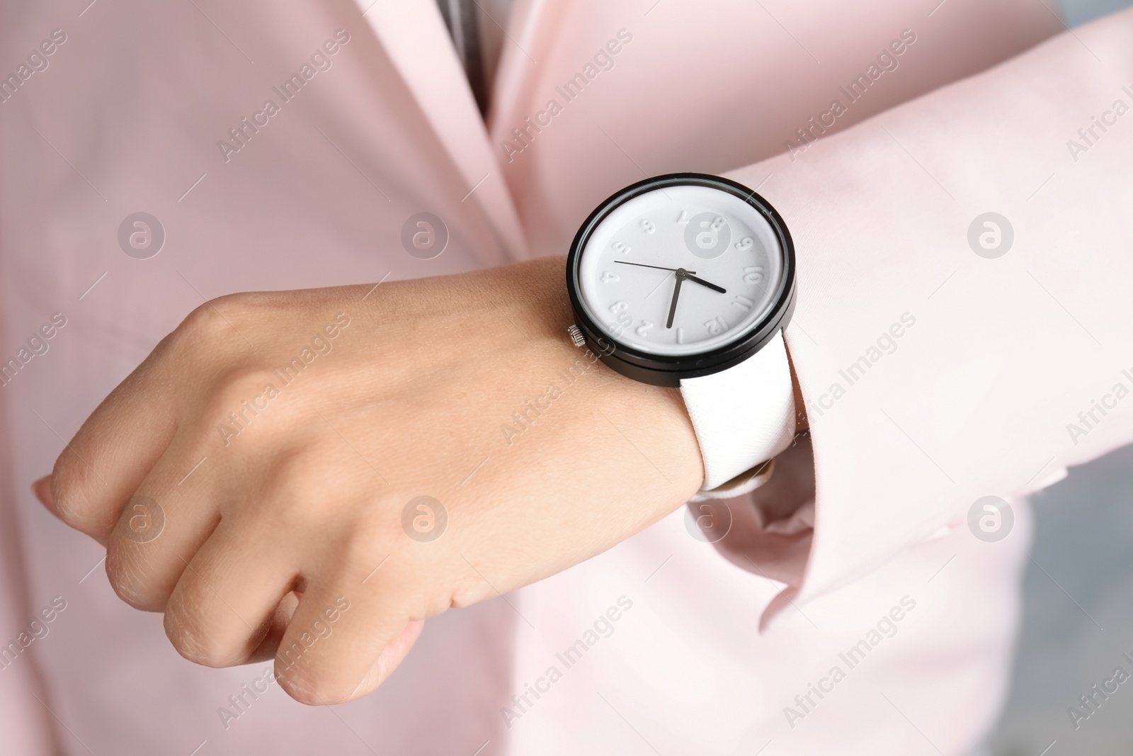 Photo of Businesswoman with stylish wrist watch, closeup. Time management