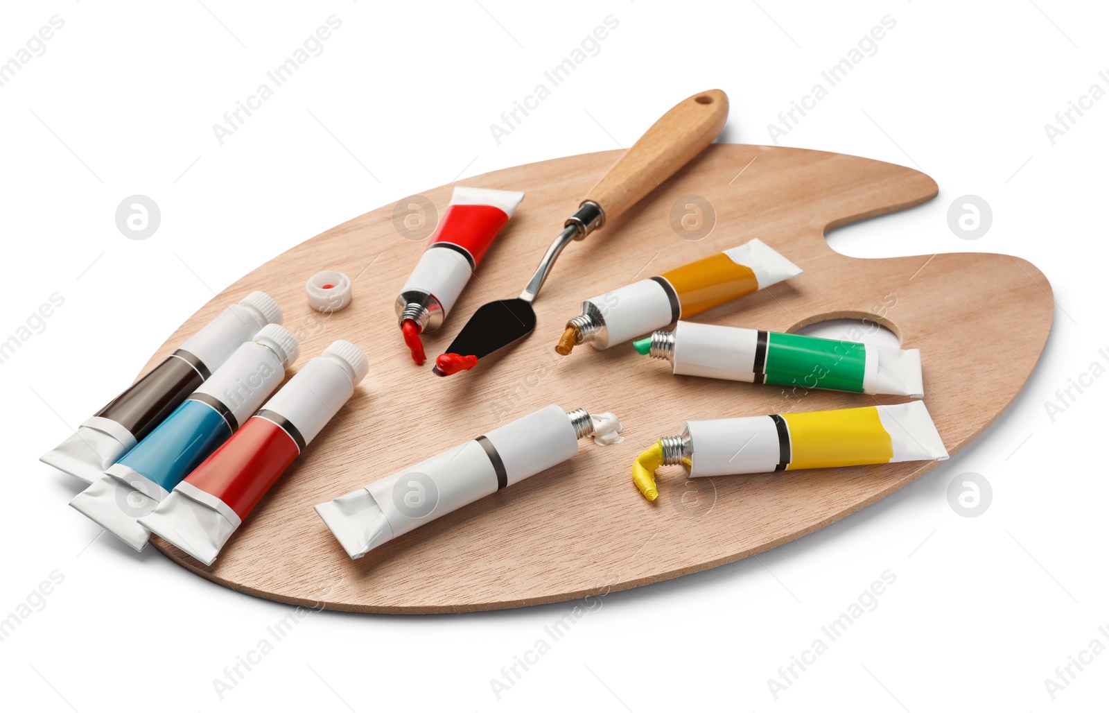 Photo of Wooden palette with oil paints and palette knife on white background