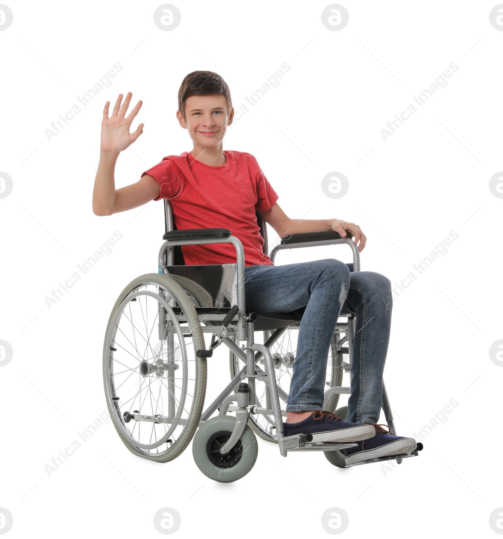 Photo of Teen boy in wheelchair on white background