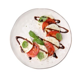 Photo of Plate of delicious Caprese salad with balsamic vinegar isolated on white, top view