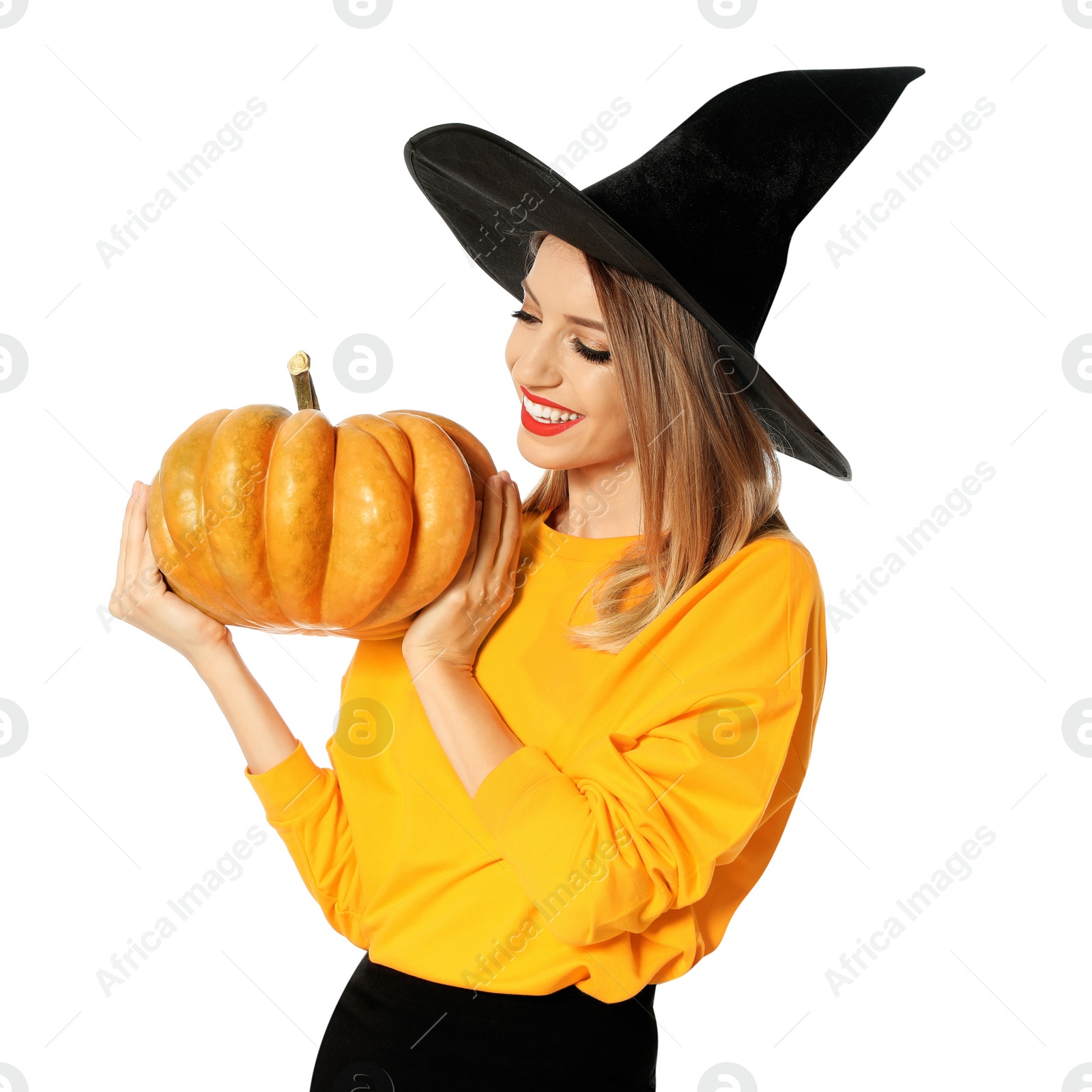 Photo of Beautiful woman wearing witch costume with pumpkin for Halloween party on white background