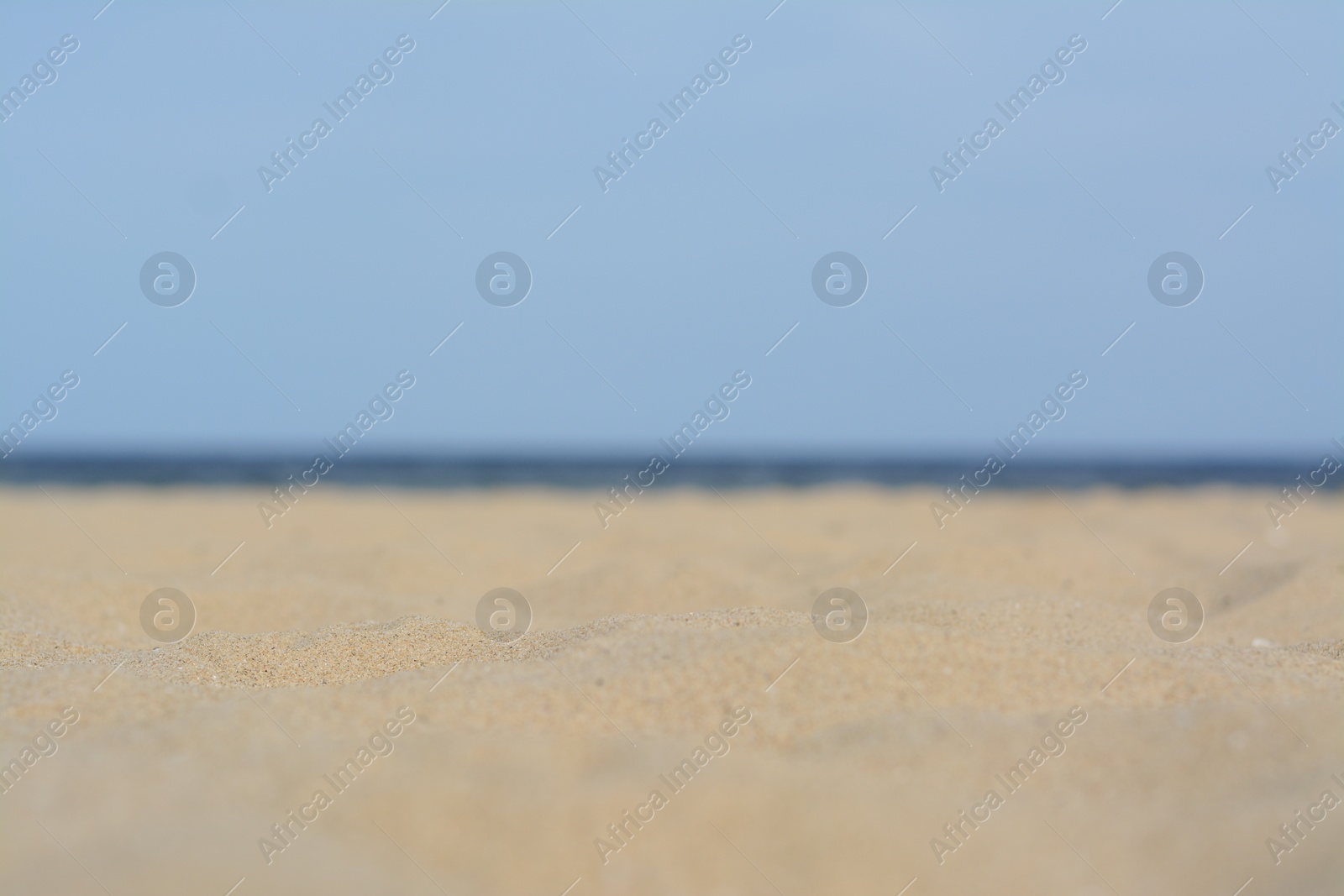 Photo of Beautiful sandy beach near sea, closeup view