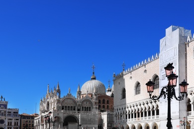 VENICE, ITALY - JUNE 13, 2019: Picturesque view of Saint Mark Square with Basilica and Doge's Palace