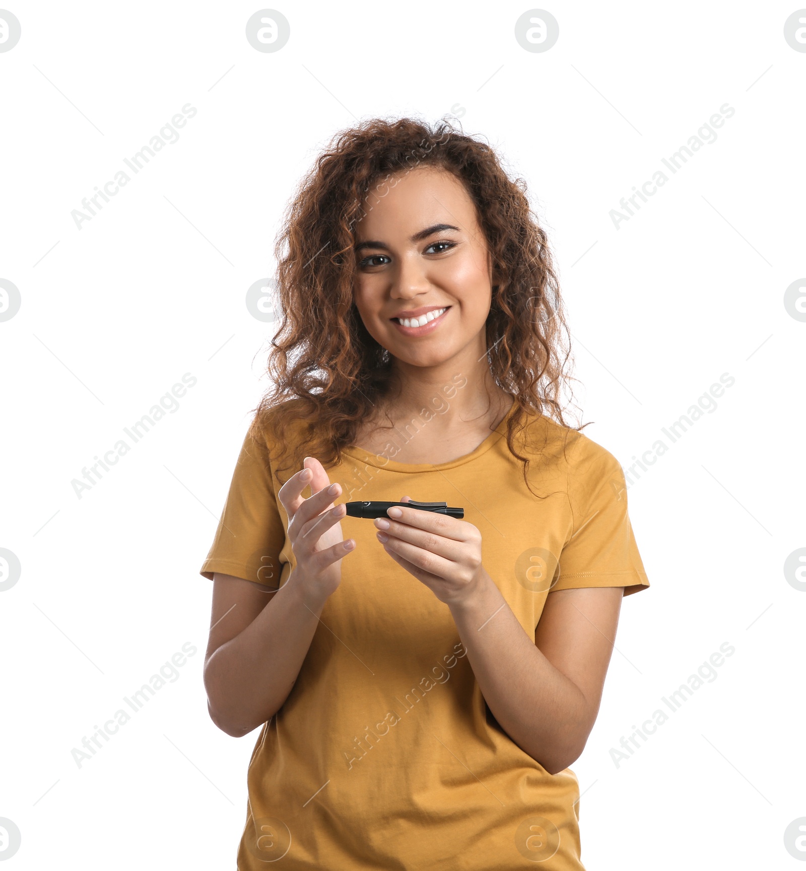 Photo of Young African-American woman using lancet pen on white background. Diabetes control