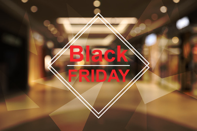 Blurred view of modern shopping mall interior. Black Friday Sale