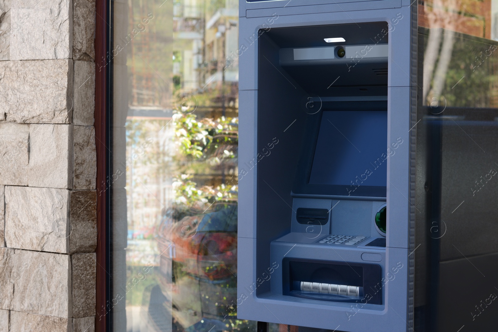 Photo of Automated teller machine outdoors on sunny day. Space for text