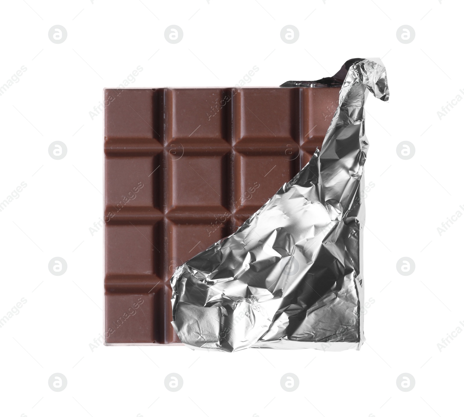 Photo of Delicious milk chocolate bar wrapped in foil isolated on white