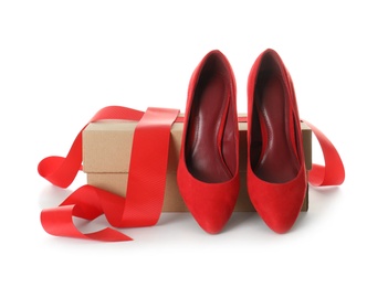 Photo of Pair of stylish shoes and carton box on white background