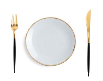 Image of Empty plate with golden fork and knife on white background, top view