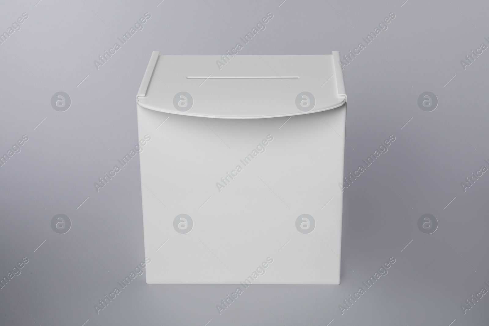 Photo of One ballot box on light grey background. Election time