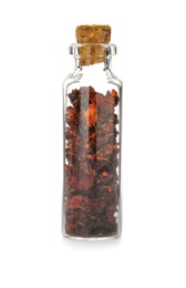 Photo of Glass bottle with spice on white background