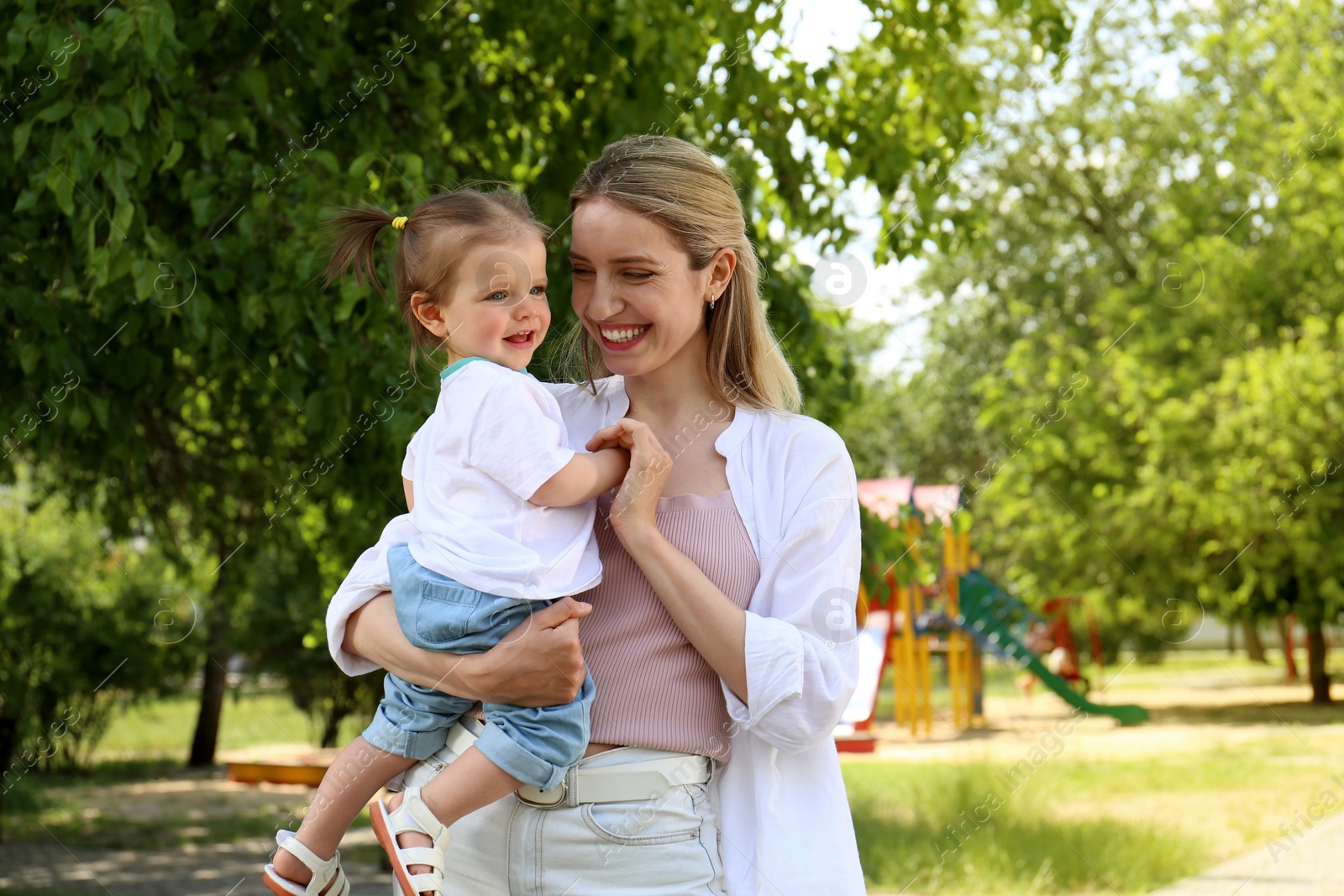 Photo of Happy mother with her daughter spending time together in park