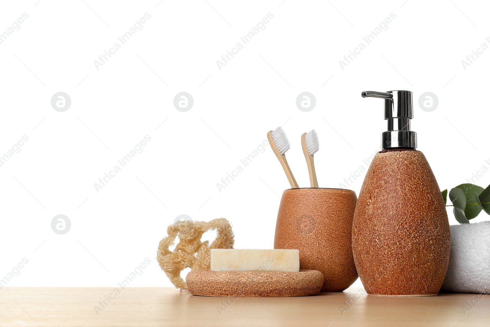 Photo of Bath accessories. Different personal care products on wooden table against white background. Space for text