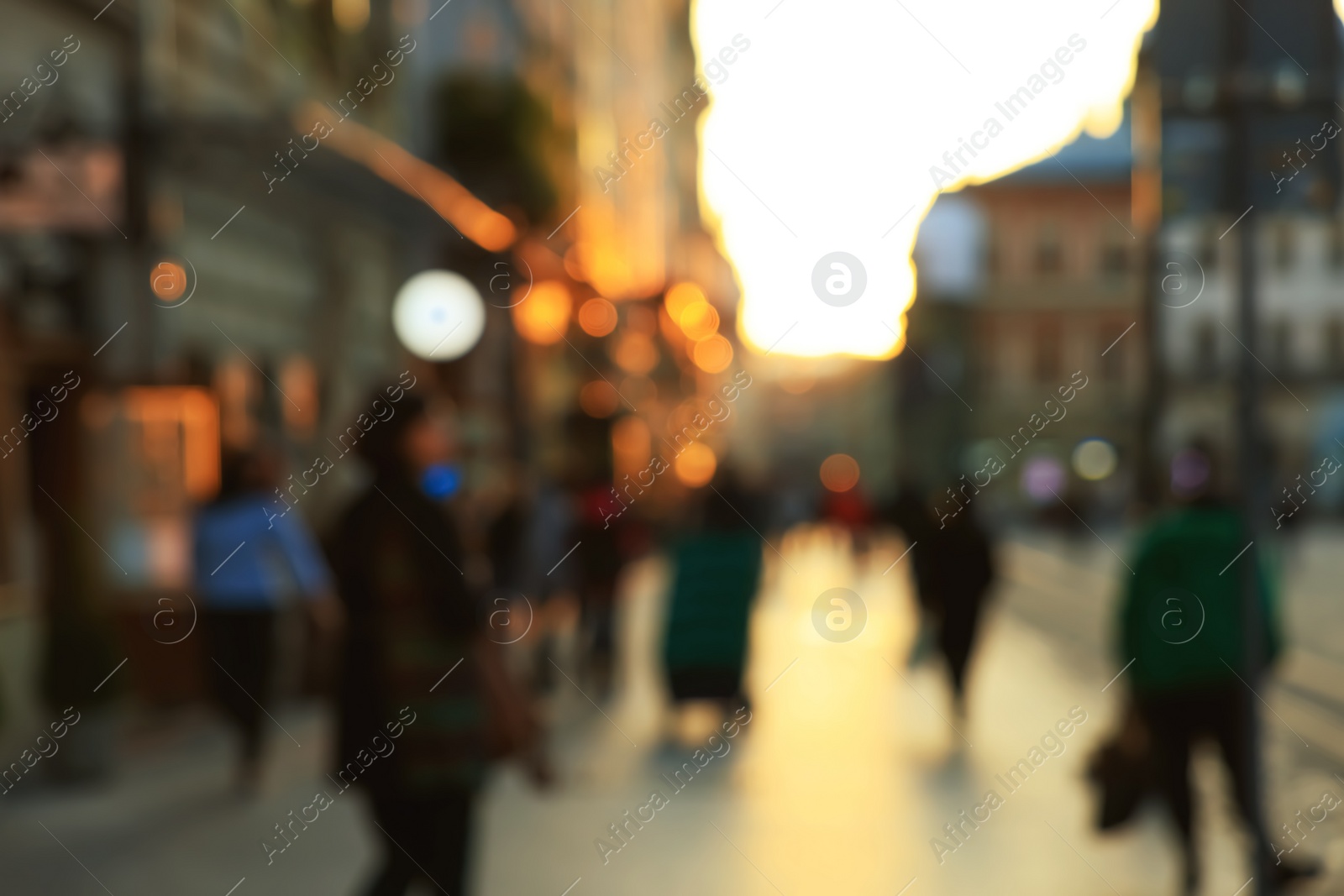 Photo of Blurred view of people walking on city street