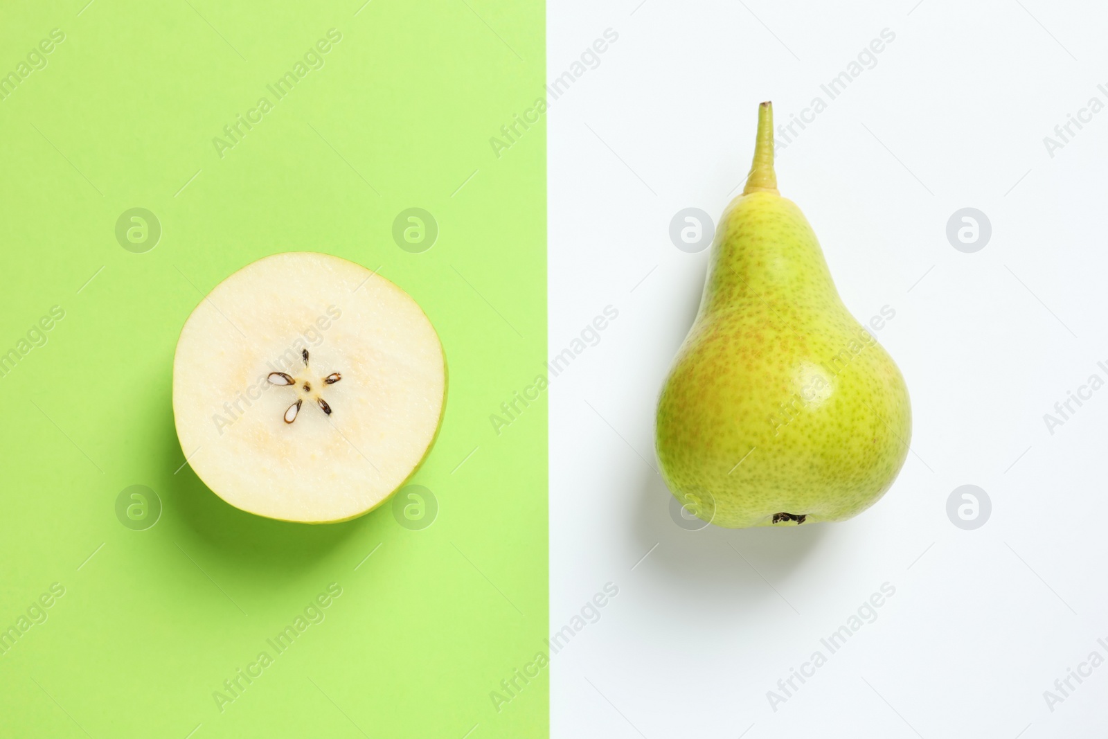 Photo of Ripe juicy pears on color background, top view