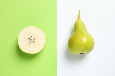 Photo of Ripe juicy pears on color background, top view