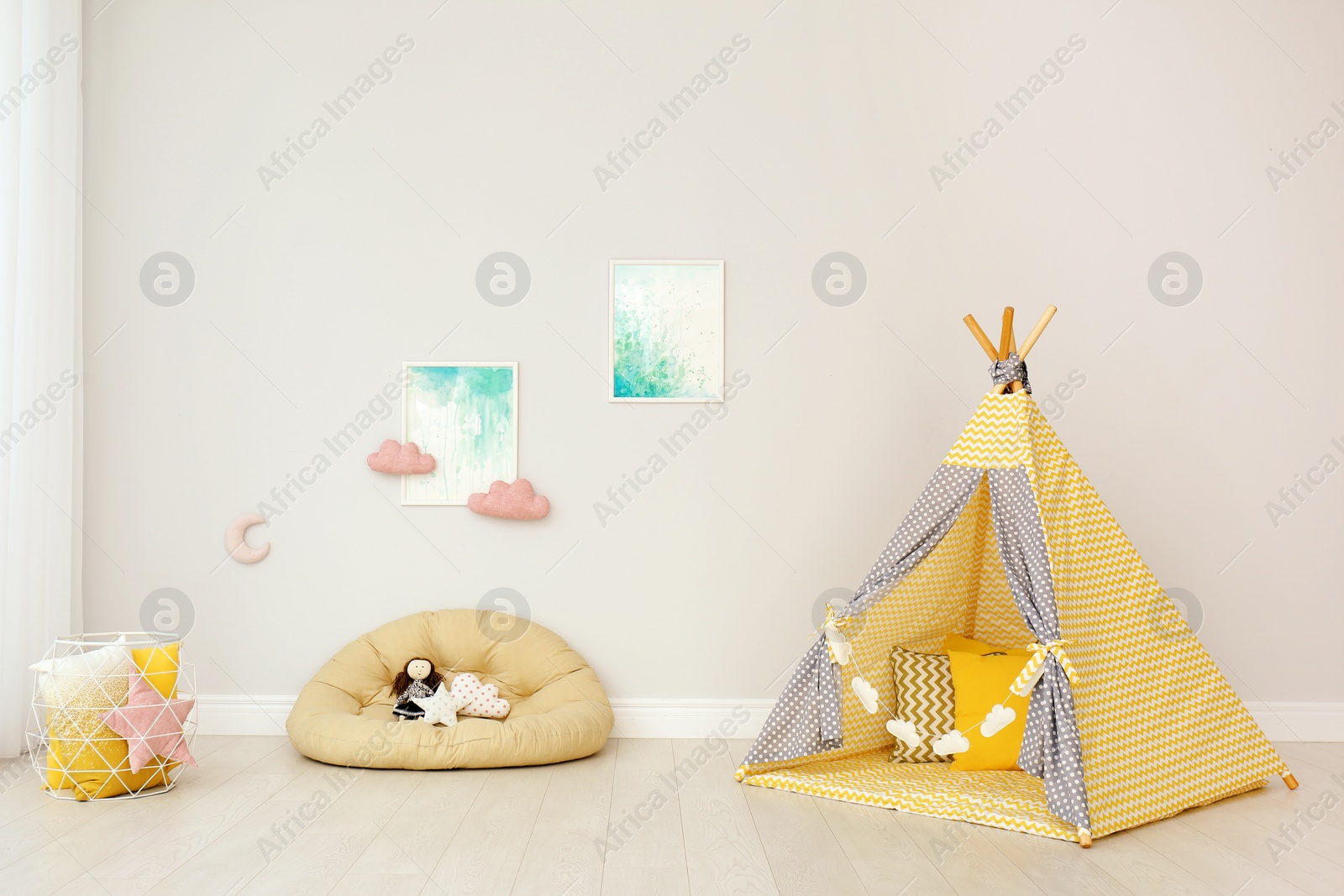 Photo of Modern nursery room interior with play tent for kids