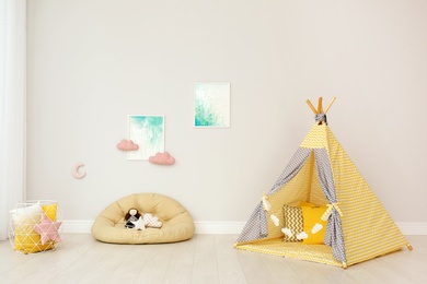 Modern nursery room interior with play tent for kids