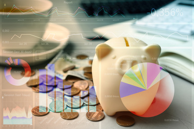Image of Forex trading. Piggy bank with money on grey table and charts
