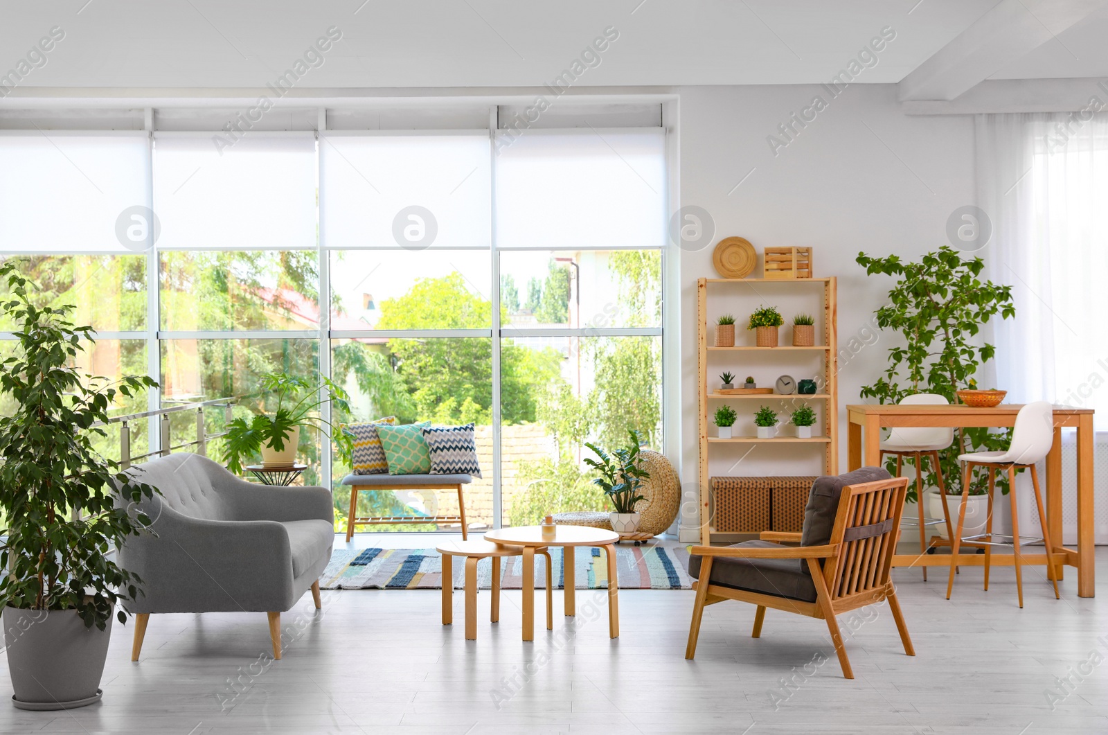 Photo of Modern living room interior with comfortable couch and wooden furniture