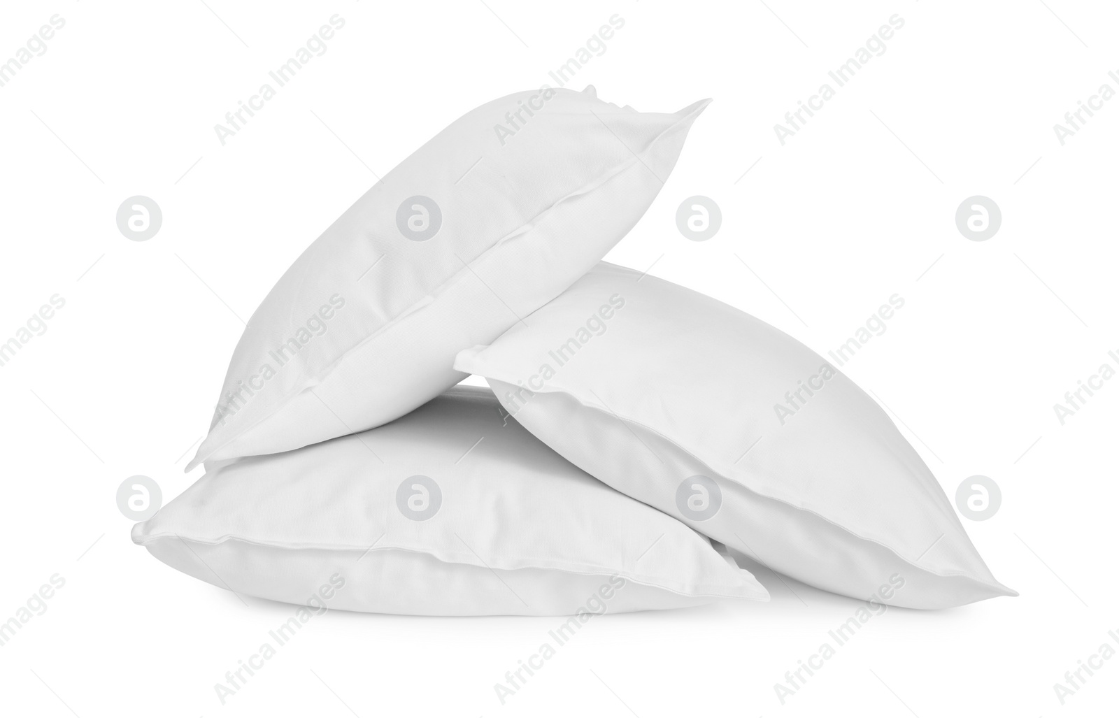 Photo of Three new soft pillows isolated on white