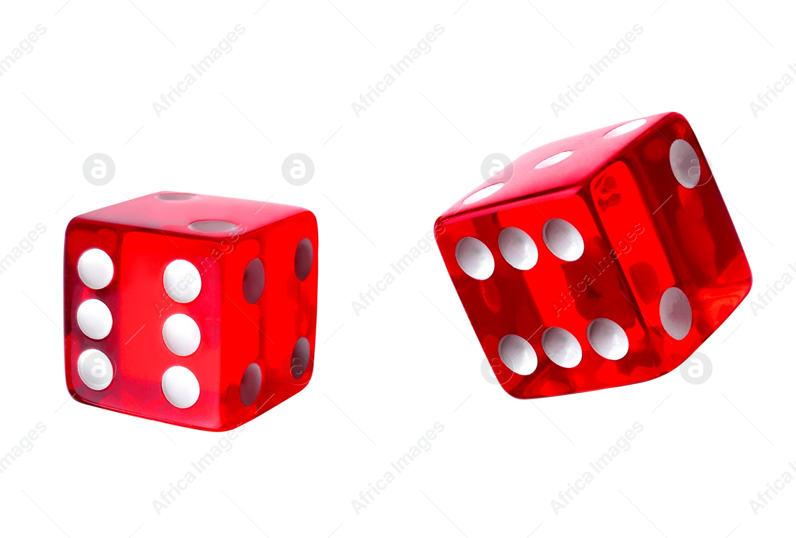 Image of Two red dice in air on white background