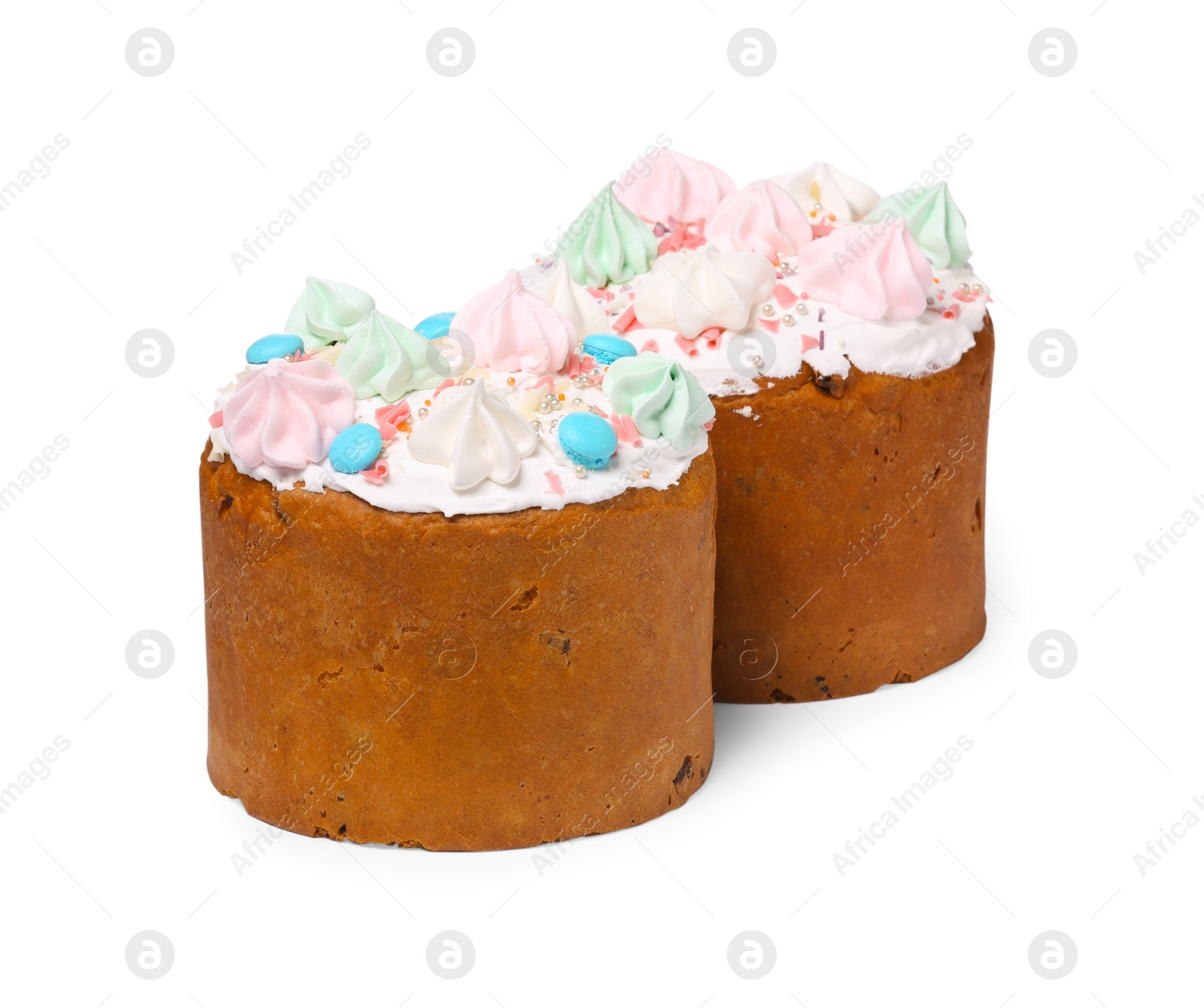 Photo of Traditional Easter cakes with sprinkles and meringues isolated on white