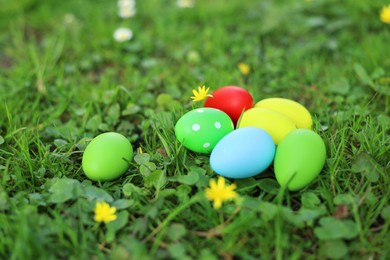 Photo of Easter celebration. Painted eggs on green grass