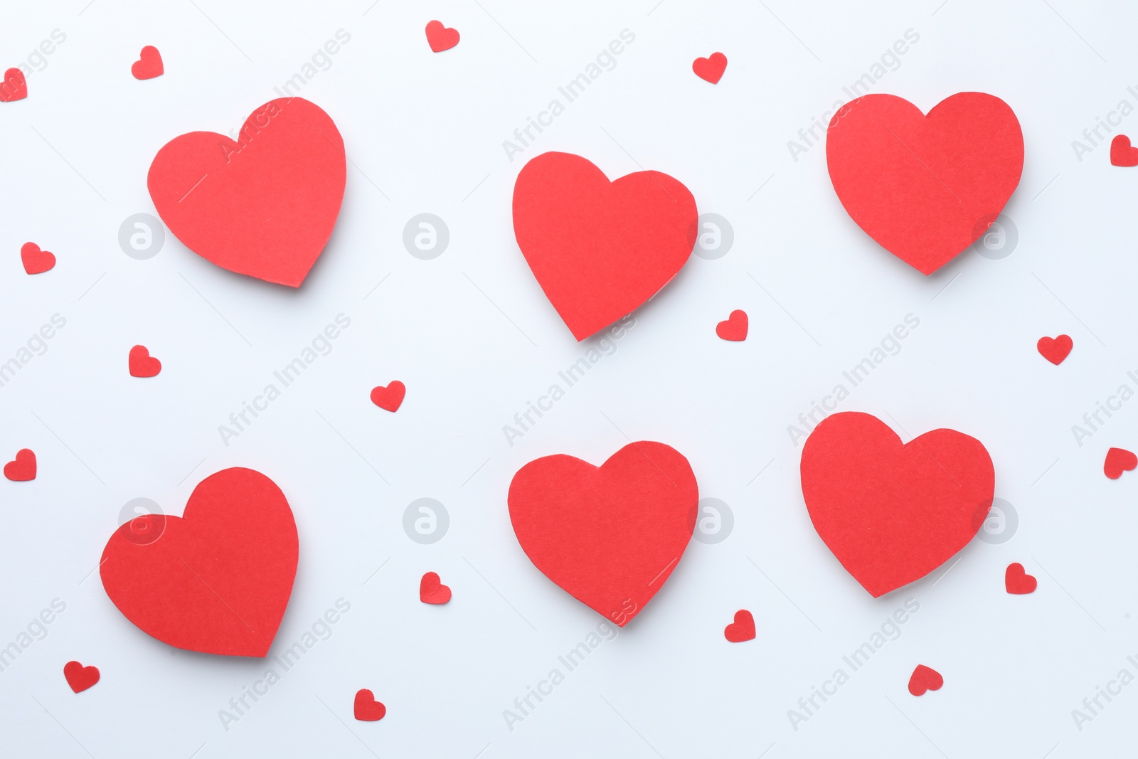 Photo of Paper hearts on white background, flat lay