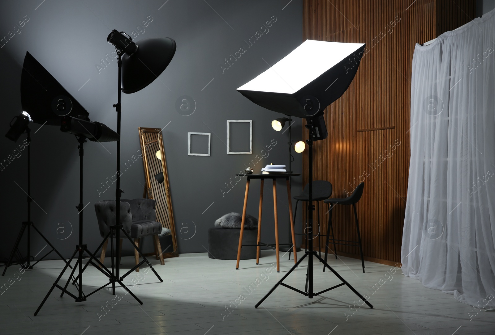 Photo of Example of living room interior design and professional equipment in photo studio