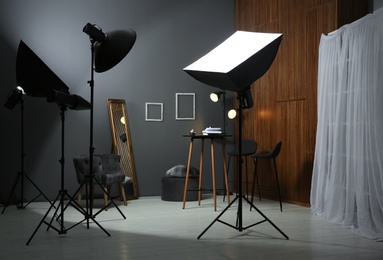 Photo of Example of living room interior design and professional equipment in photo studio