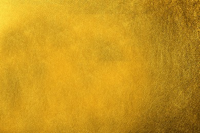 Image of Golden textured surface as background, closeup view