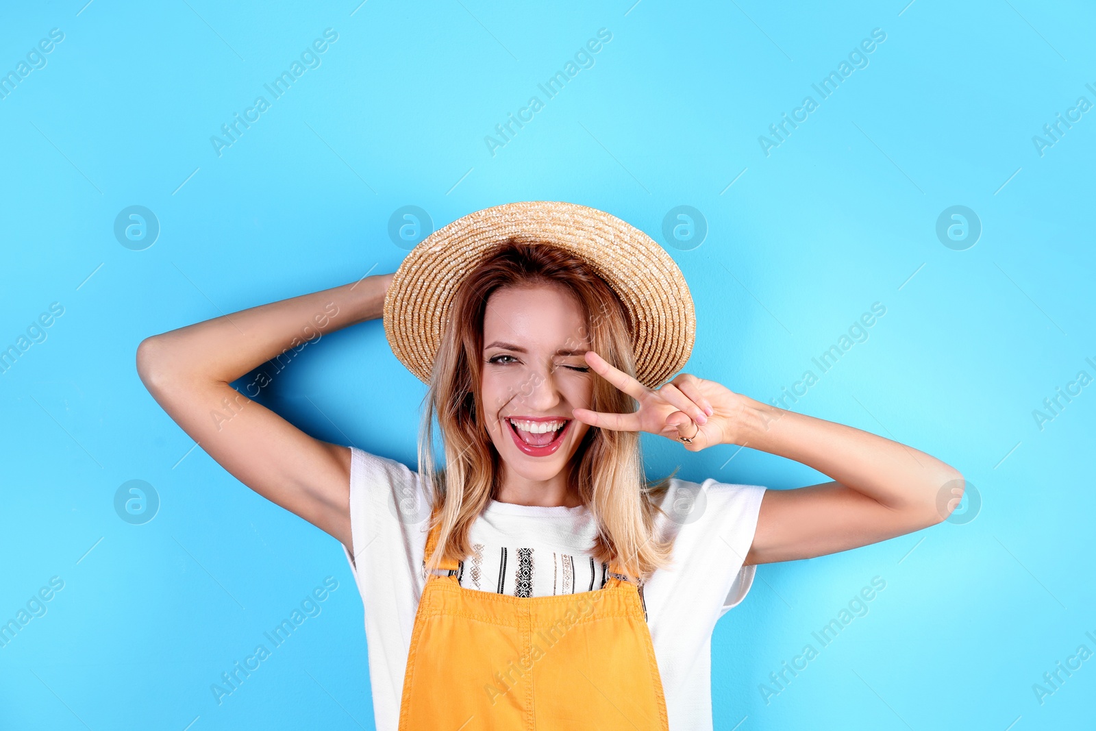 Photo of Portrait of beautiful laughing woman on color background