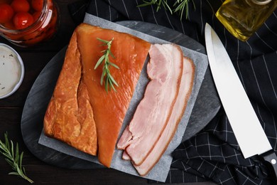 Photo of Flat lay composition with delicious smoked bacon on wooden table