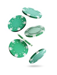 Image of Green casino chips falling on white background