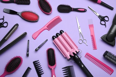 Photo of Flat lay compositiondifferent professional hairdresser tools on lilac background