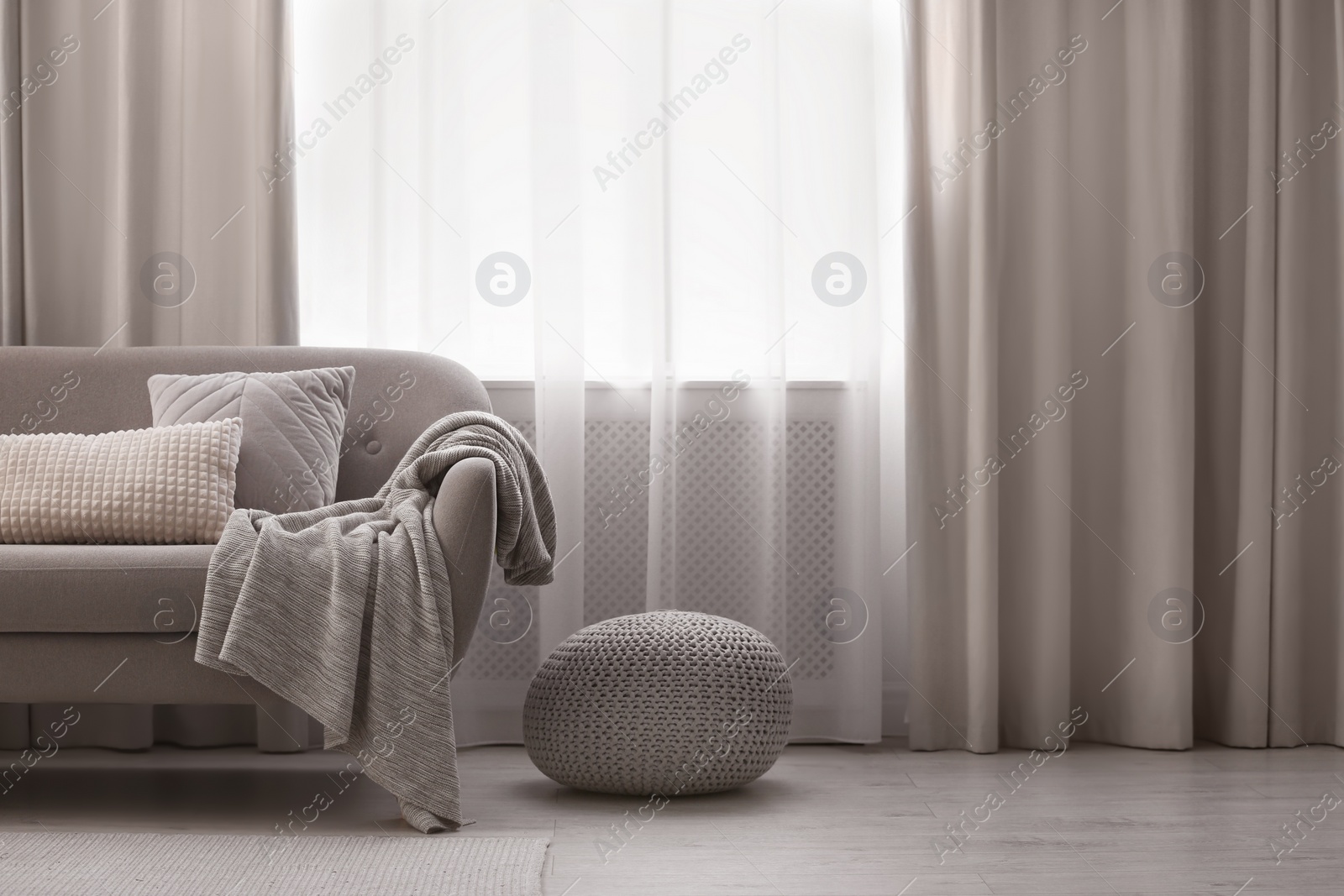 Photo of Beautiful curtains on window in stylish living room interior