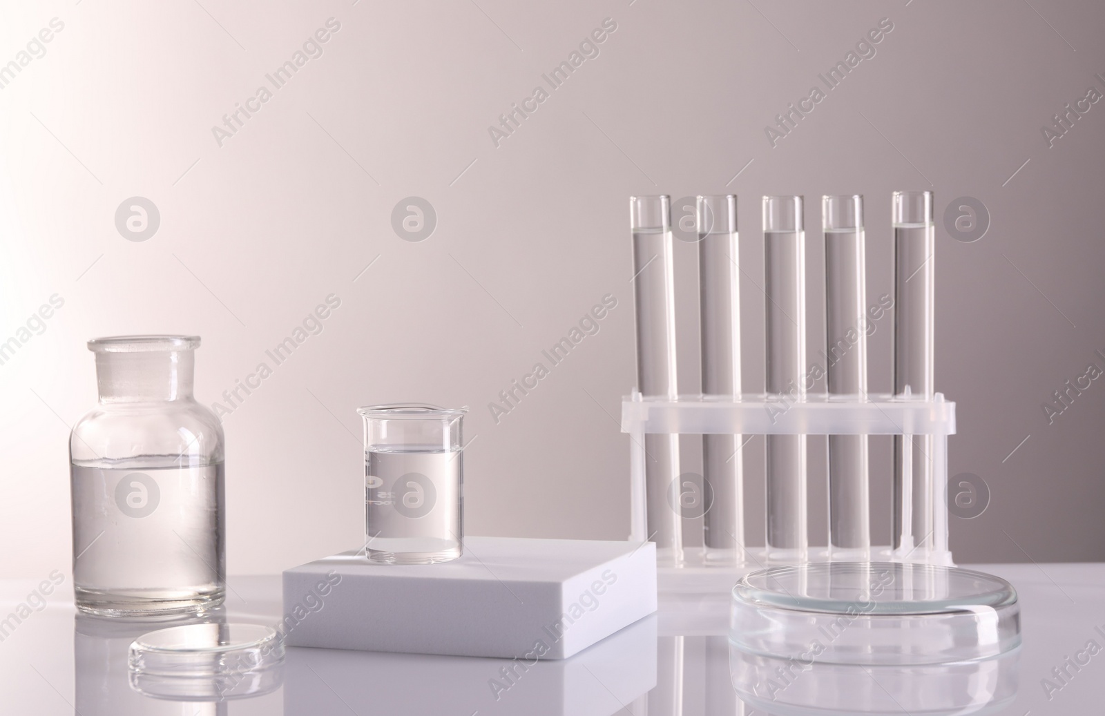 Photo of Laboratory analysis. Different glassware on table against light background