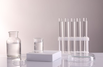 Photo of Laboratory analysis. Different glassware on table against light background