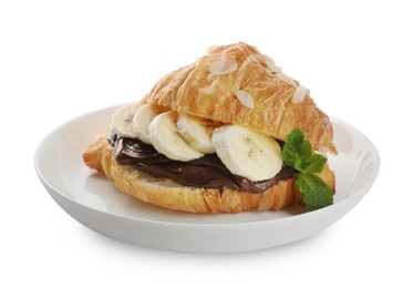 Photo of Delicious croissant with banana, chocolate and mint isolated on white