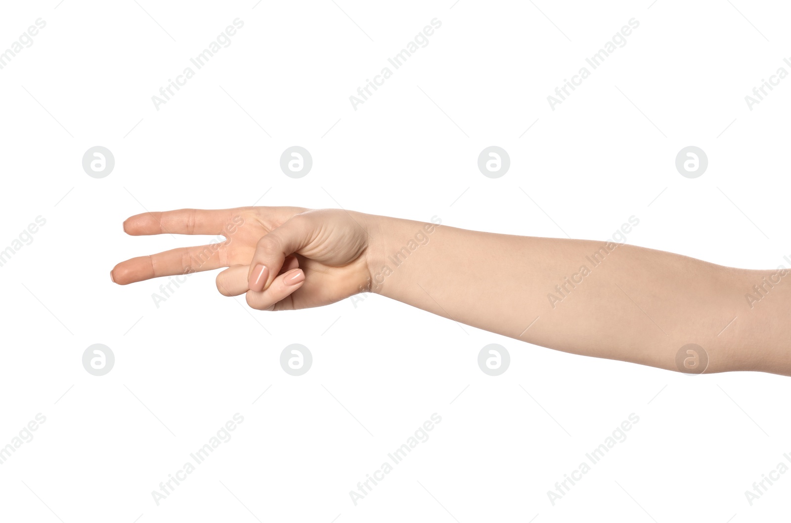 Photo of Playing rock, paper and scissors. Woman making scissors with her fingers on white background, closeup