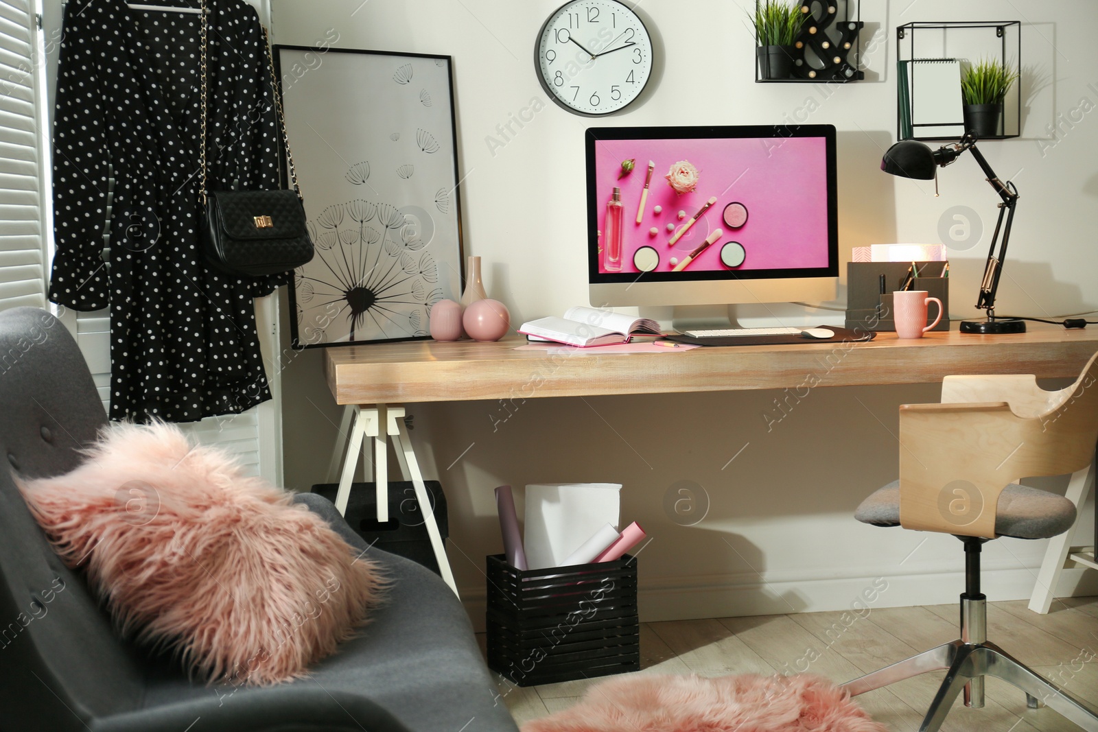 Photo of Modern workplace interior with computer on table