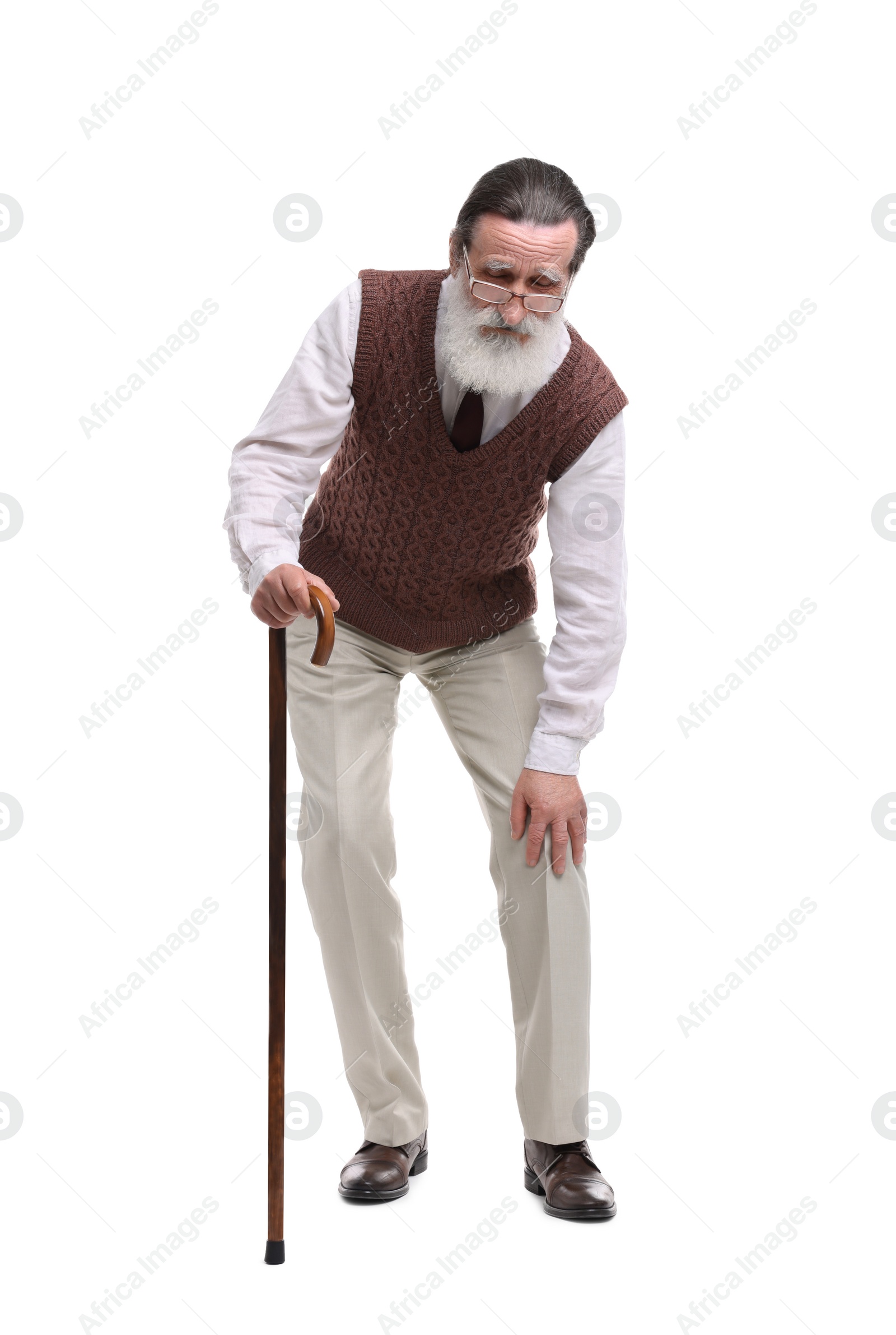 Photo of Senior man with walking cane suffering from knee pain on white background