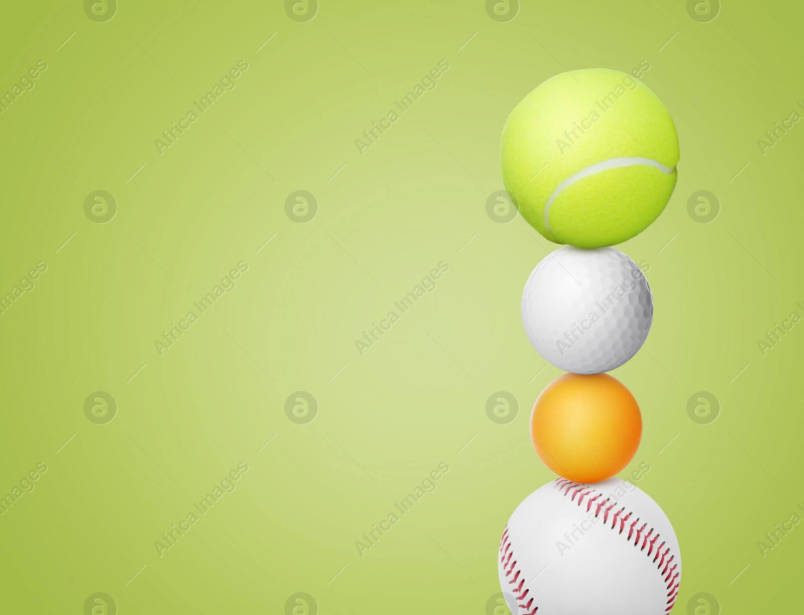 Image of Stack of different sport balls on green yellow background, space for text